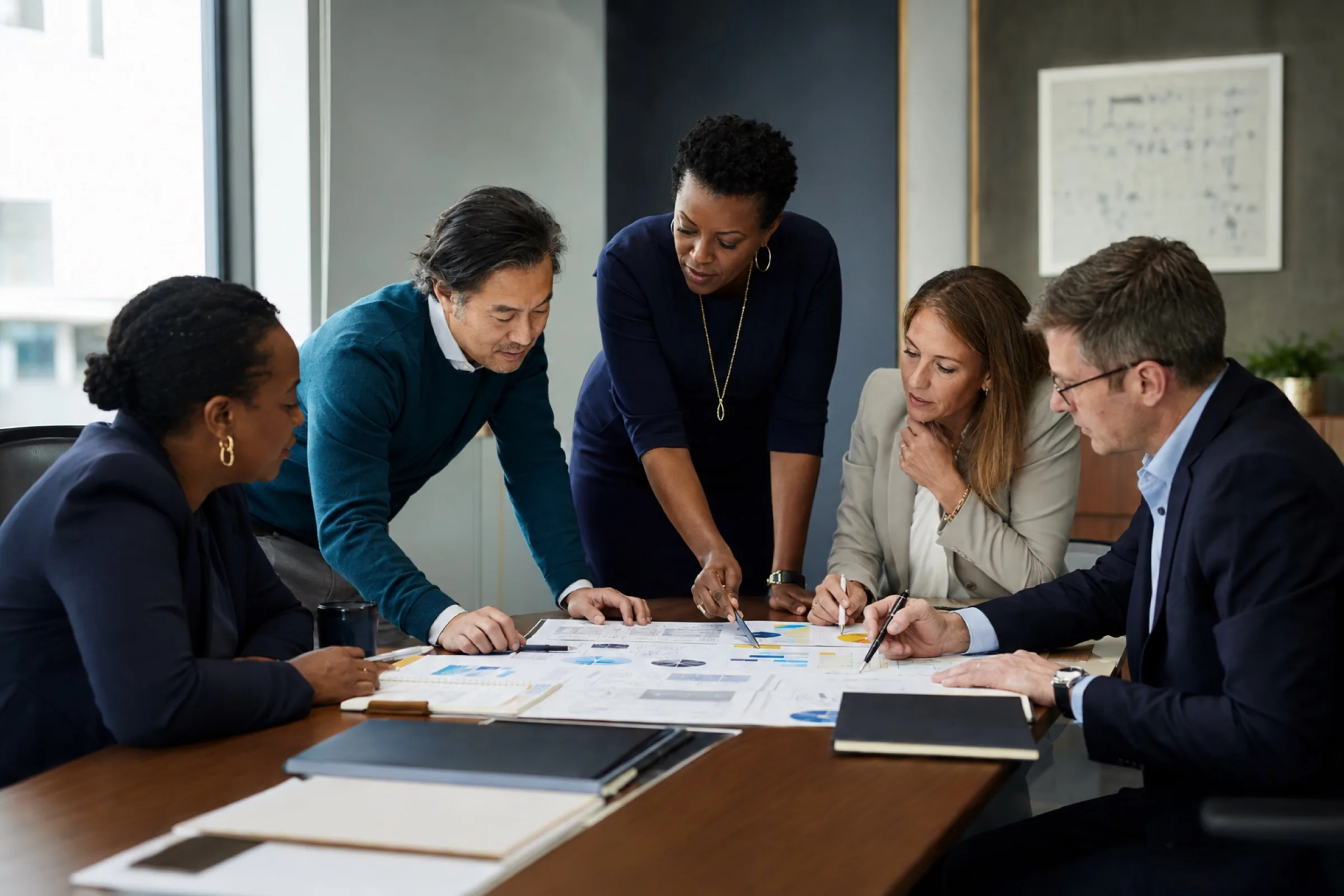 A cross-functional team working through shared plans